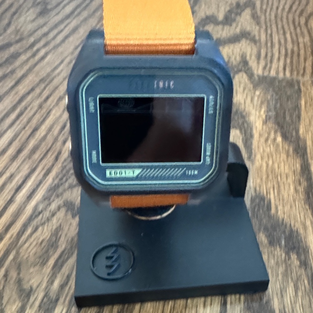 Electric EDO1-T Surf Watch. Translucent gray case with bright orange strap.